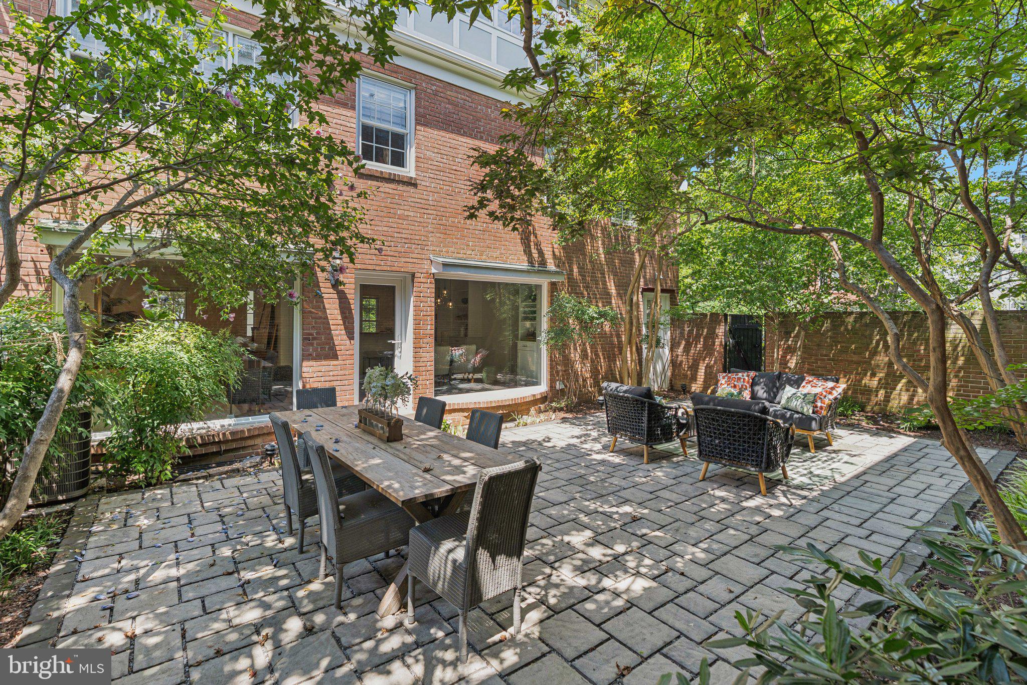 657 E Street Southeast Washington, DC 20003 - Photo 4 of 41 a view of a patio with table and chairs and potted plants