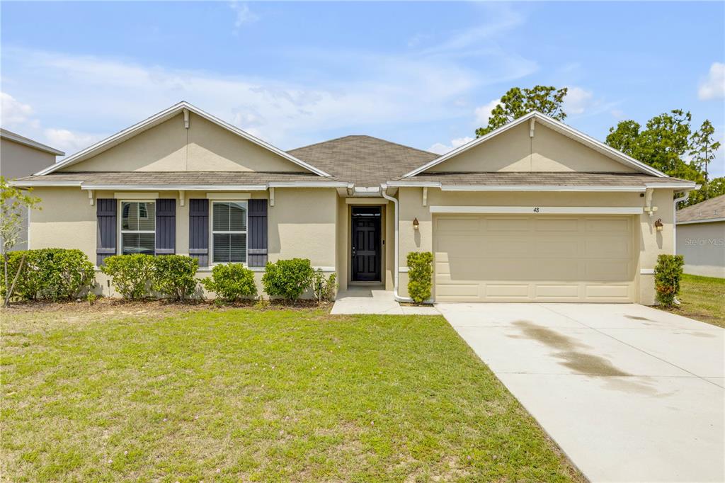48 Hickory Loop Ocala, FL 34472 - Photo 52 of 52 a front view of a house with yard