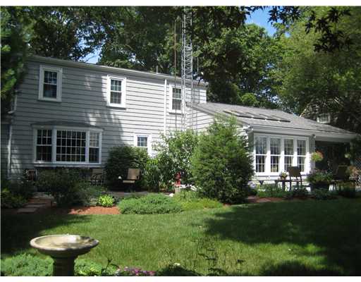 Exterior Back. The house has a lovely family room addition.