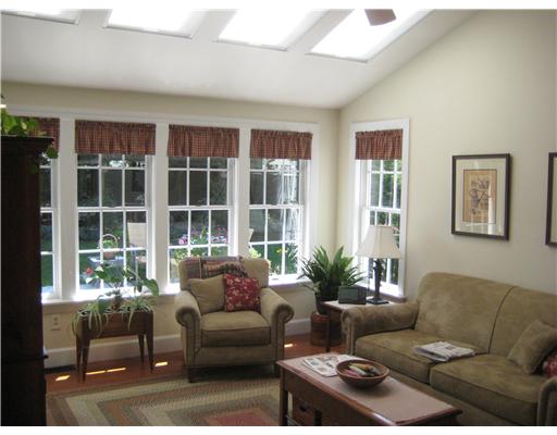 Den/Family/Great Room. The family room has skylights, a bank of south facing windows overlooking a beautifully landscaped yard.