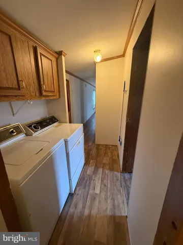 a view of a kitchen from a hallway