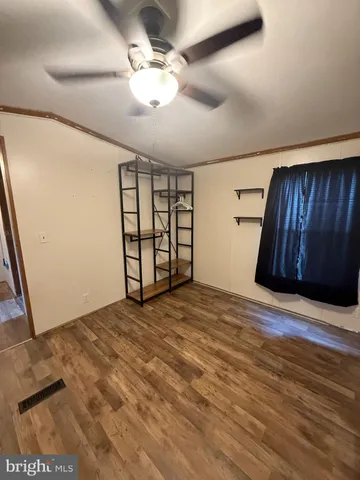 a view of an empty room with a fireplace