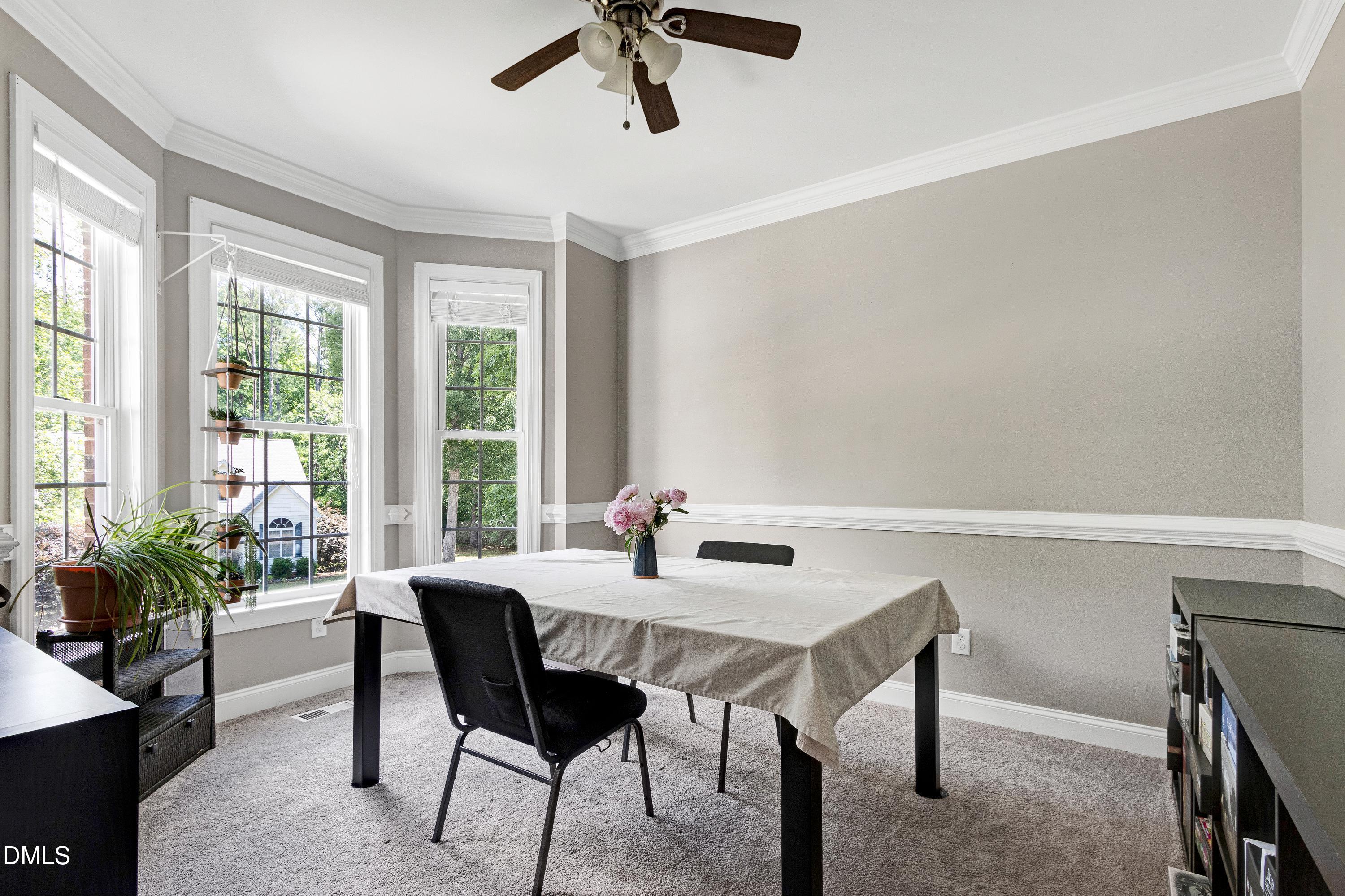 1320 Taylor Farm Road Raleigh, NC 27603 - Photo 9 of 56 a dining room with furniture and window