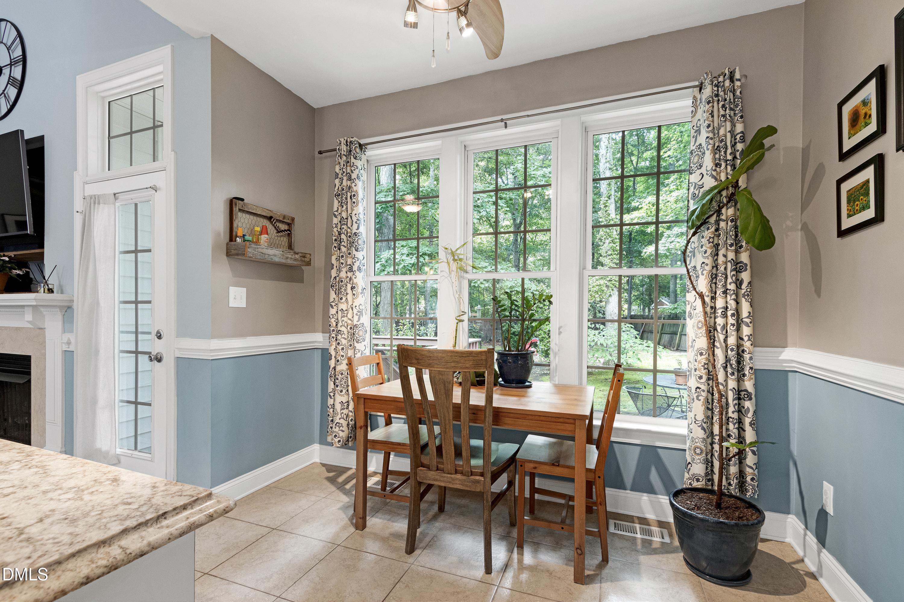 1320 Taylor Farm Road Raleigh, NC 27603 - Photo 20 of 56 a view of a dining room with furniture and a potted plant