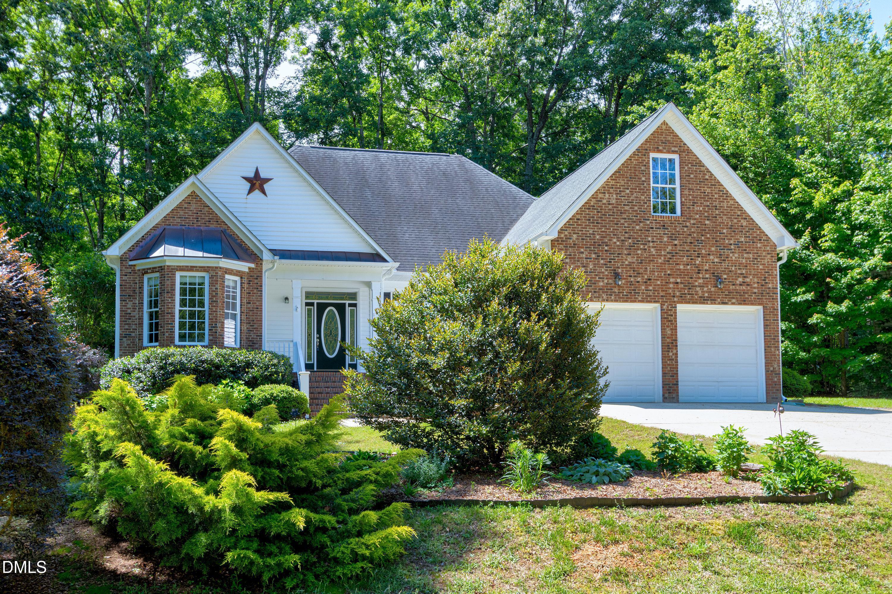 1320 Taylor Farm Road Raleigh, NC 27603 - Photo 33 of 56 a front view of a house with a yard