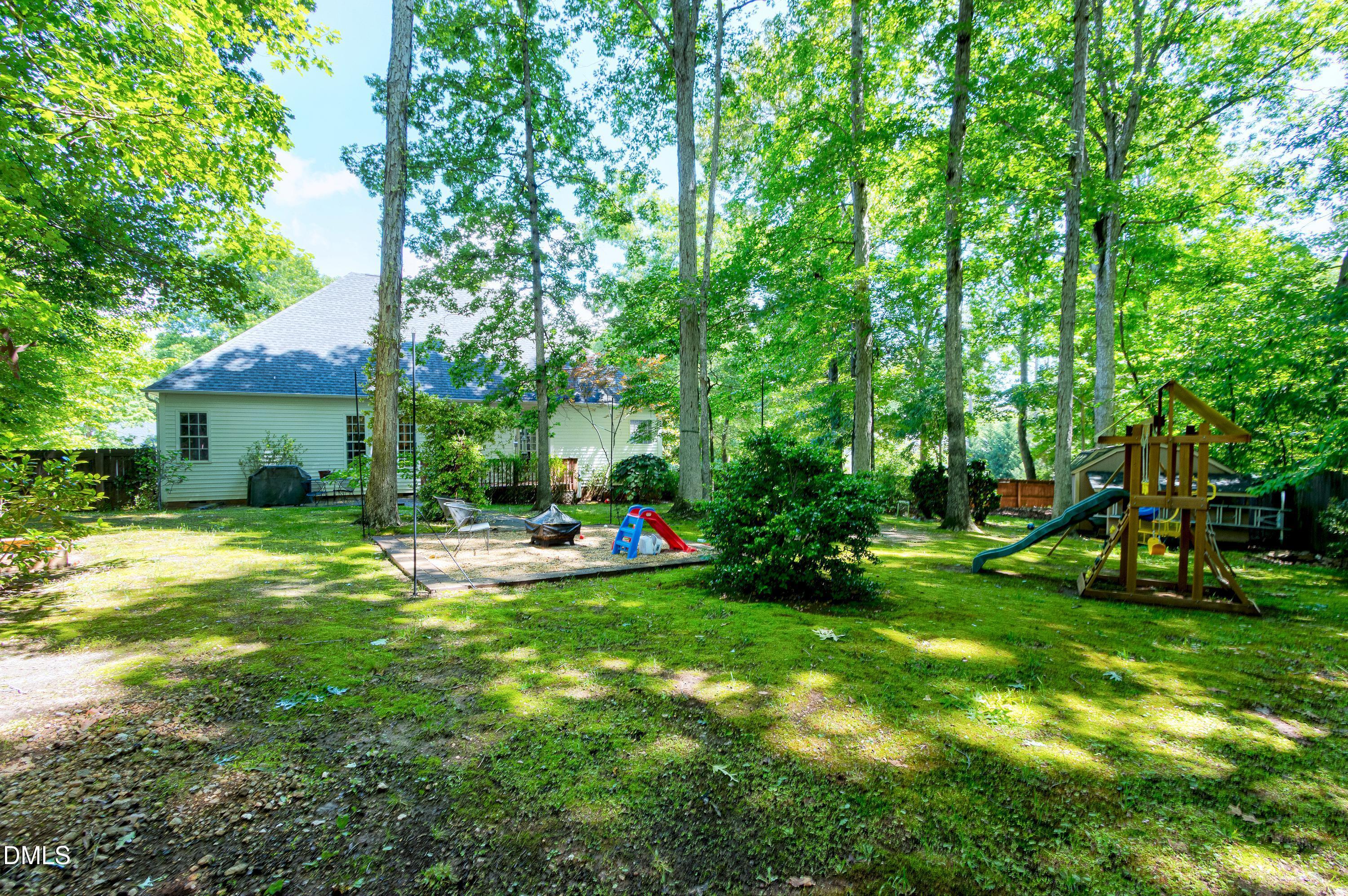1320 Taylor Farm Road Raleigh, NC 27603 - Photo 36 of 56 a view of a house with a yard and sitting area