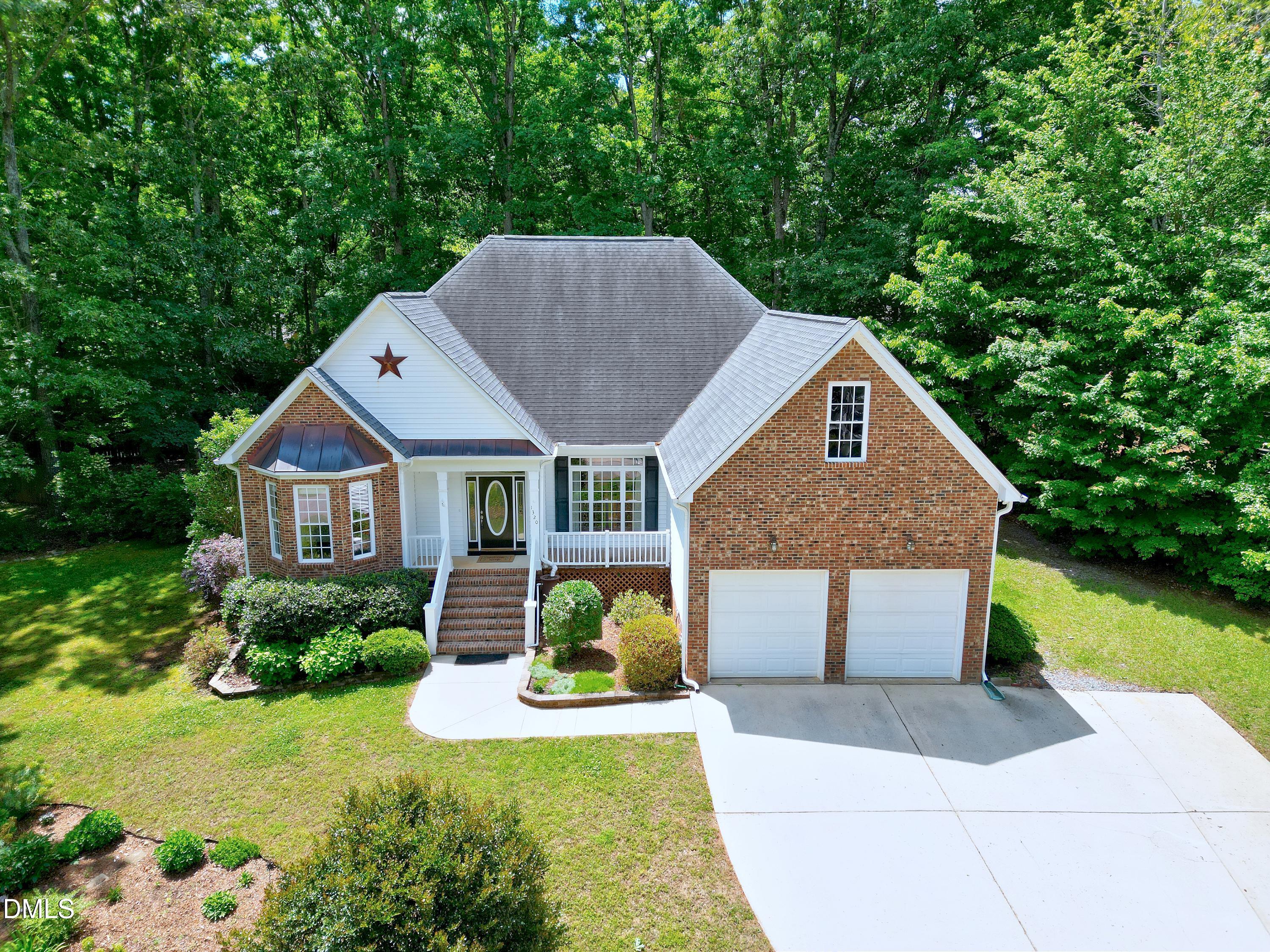 1320 Taylor Farm Road Raleigh, NC 27603 - Photo 44 of 56 a front view of house with yard and green space