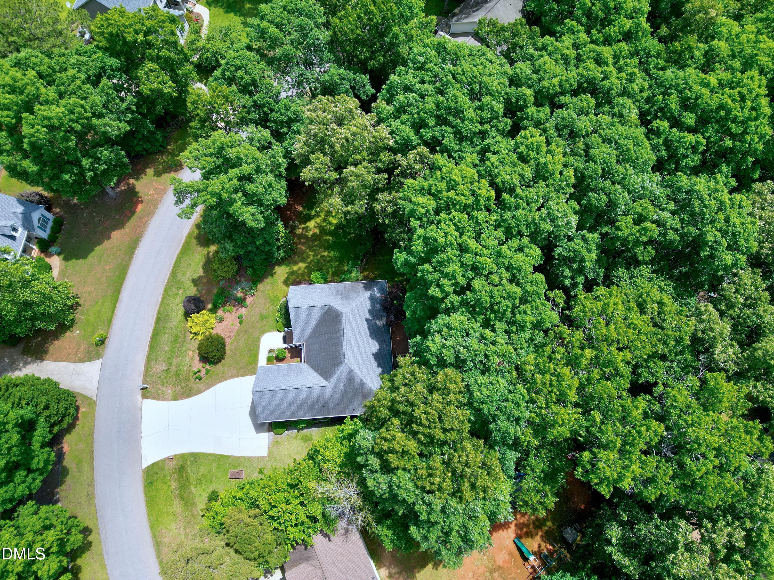 1320 Taylor Farm Road Raleigh, NC 27603 - Photo 47 of 56 an aerial view of a house with a yard and large trees