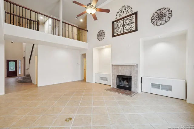 a view of an empty room with a fireplace