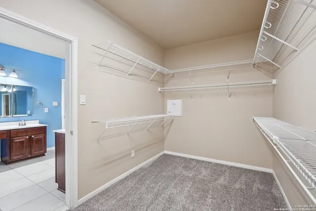 a view of an empty walk in closet