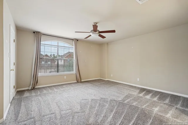 a view of a big room with carpet