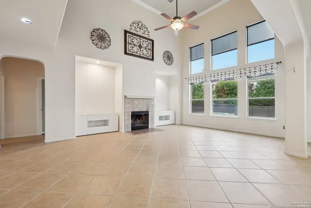 a view of an empty room with a fireplace