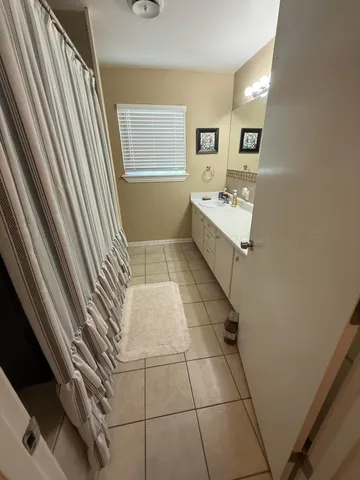 a bathroom with a bathtub and a sink
