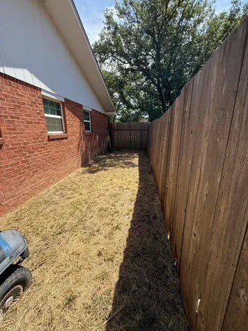 a view of a house with a yard porch and sitting area
