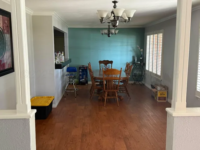 a view of a livingroom with furniture and a window