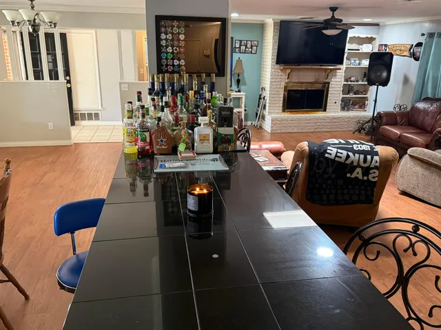 a living room with furniture fireplace and flat screen tv