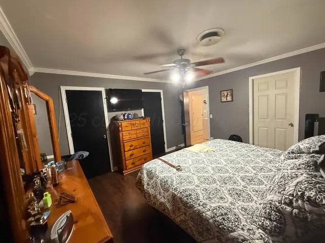 a bedroom with a bed and a walk in closet