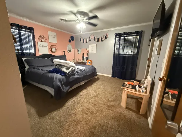 a bedroom with a bed furniture and a window