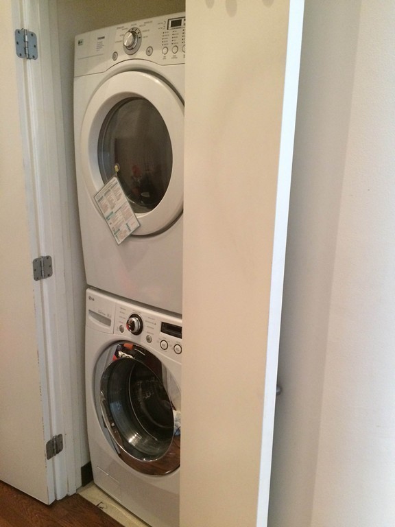 88 Kingston Street, Unit 1E Boston, MA 02111 - Photo 6 of 11 a utility room with dryer and washer
