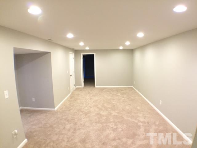 5016 Dantree Place Raleigh, NC 27609 - Photo 13 of 16 an empty room with natural light