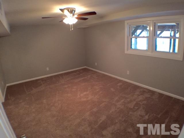 5016 Dantree Place Raleigh, NC 27609 - Photo 14 of 16 an empty room with a window