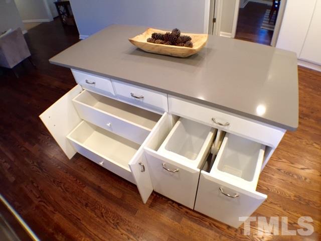 5016 Dantree Place Raleigh, NC 27609 - Photo 7 of 16 a room with wooden floor and shoes
