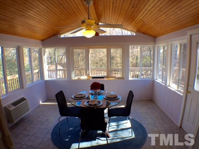 5016 Dantree Place Raleigh, NC 27609 - Photo 8 of 16 a dining room with furniture a chandelier and wooden floor