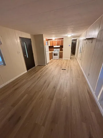 a view of a livingroom with wooden floor