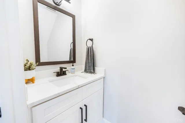 a view of a living room with wooden floor