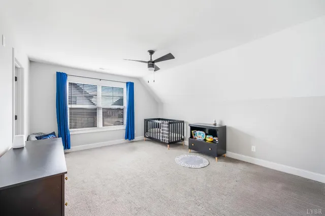 a bathroom with a granite countertop sink a toilet and a mirror