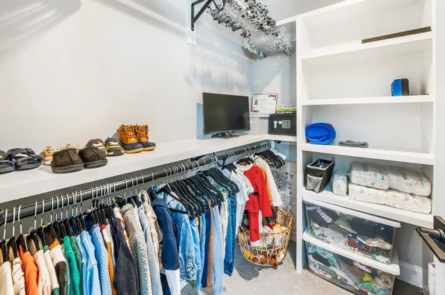 a bathroom with double vanity sink and a mirror