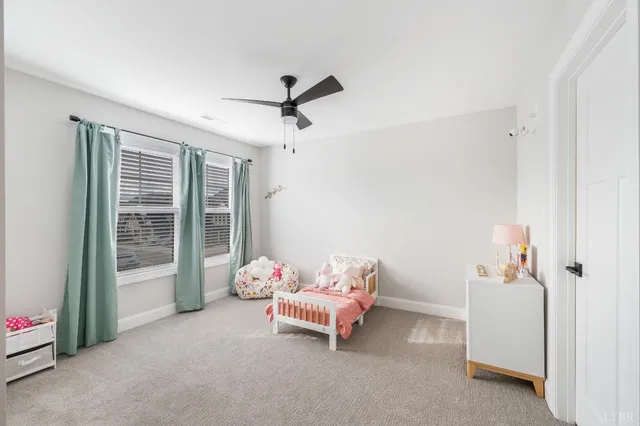 a white toilet sitting next to a shower curtain