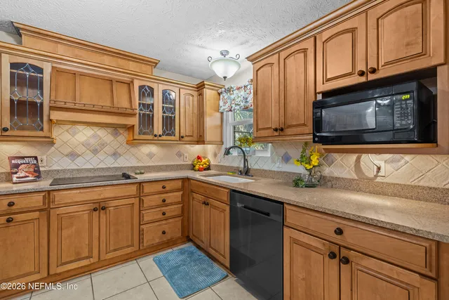 a kitchen with a sink and cabinets