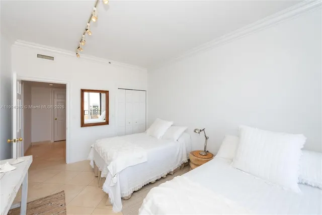 a bedroom with double bed and a window