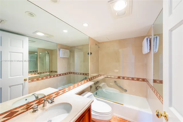 a bathroom with a bathtub and a sink
