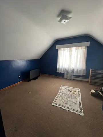 a bed room with a bed and furniture