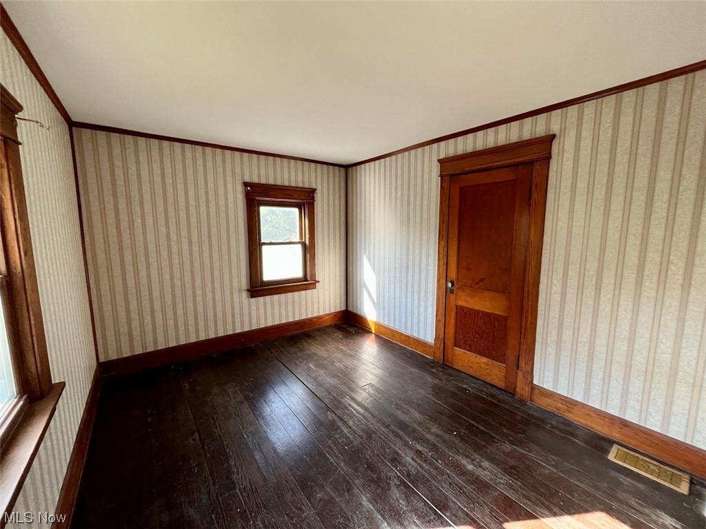 16485 Mock Road Berlin Center, OH 44401 - Photo 22 of 30 Hardwood floored spare room with ornamental molding