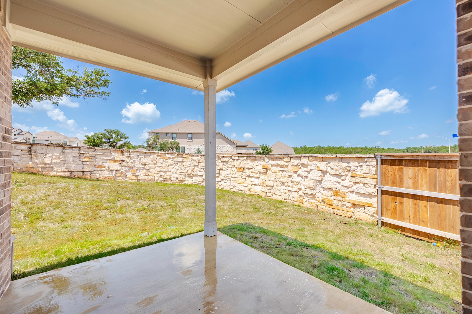 900 Balsora Cove Georgetown, TX 78628 - Photo 28 of 39 Enjoy outdoor moments on this covered patio, overlooking a private yard with a stone privacy fence.