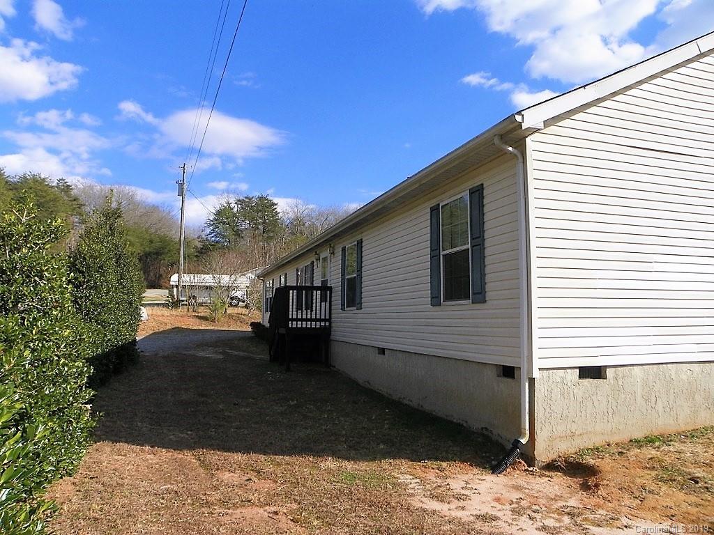 2001 Silver Creek Road Mill Spring, NC 28756 - Photo 2 of 31 a view of a house with backyard and a patio