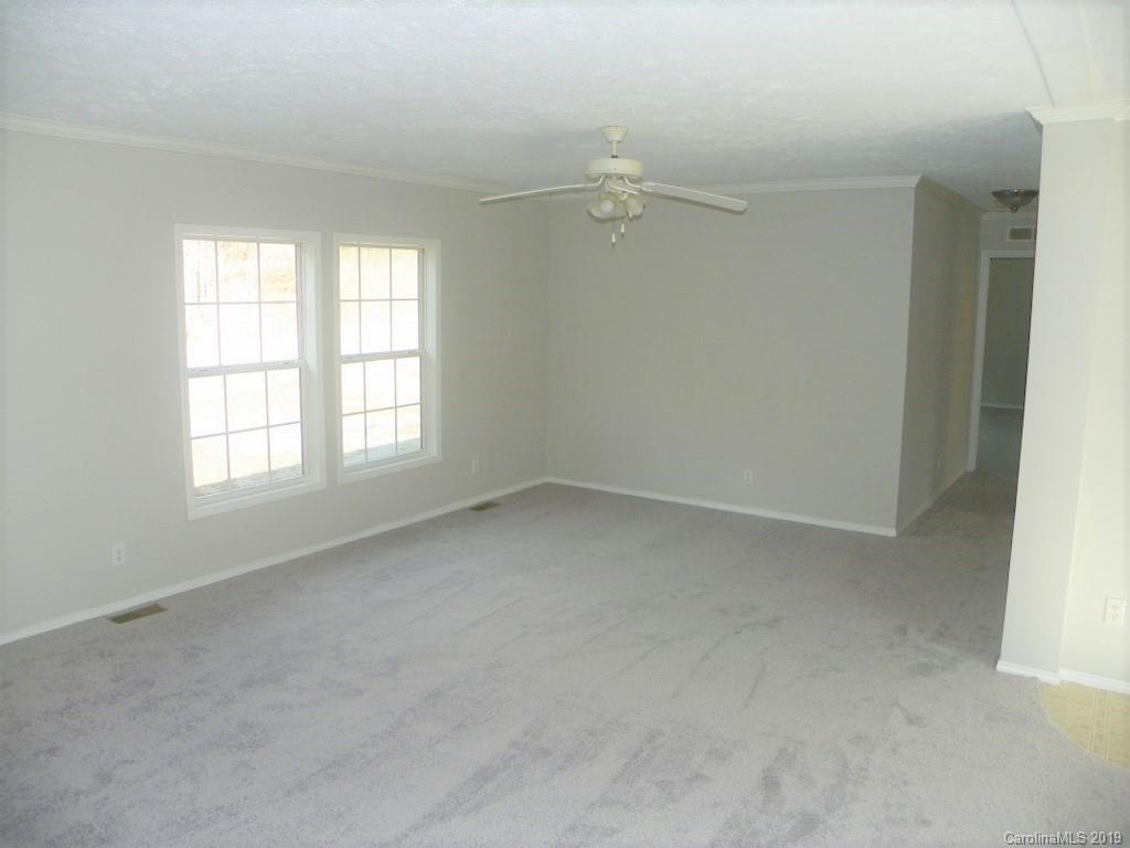 2001 Silver Creek Road Mill Spring, NC 28756 - Photo 11 of 31 an empty room with a window