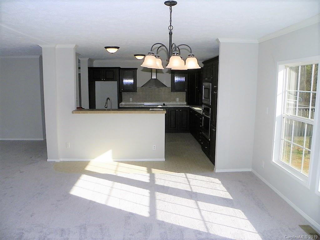 2001 Silver Creek Road Mill Spring, NC 28756 - Photo 13 of 31 a view of a room with a chandelier furniture and windows