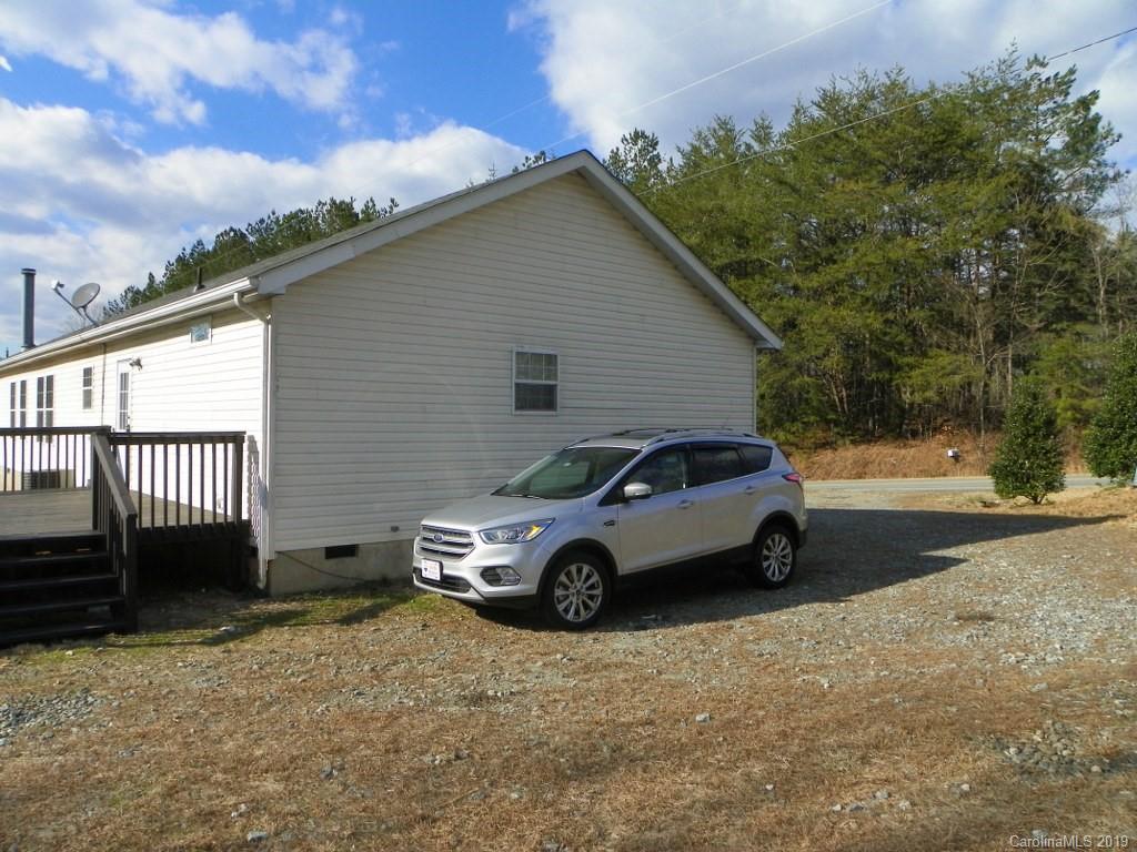 2001 Silver Creek Road Mill Spring, NC 28756 - Photo 3 of 31 a car parked in front of a house