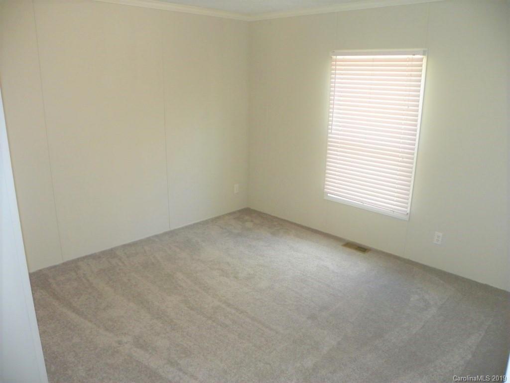 2001 Silver Creek Road Mill Spring, NC 28756 - Photo 26 of 31 an empty room with a window
