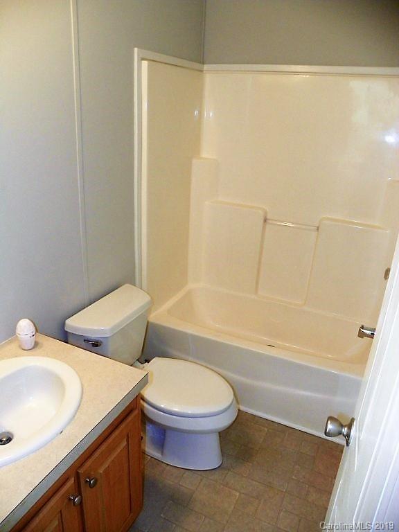 2001 Silver Creek Road Mill Spring, NC 28756 - Photo 27 of 31 a bathroom with a sink and a toilet