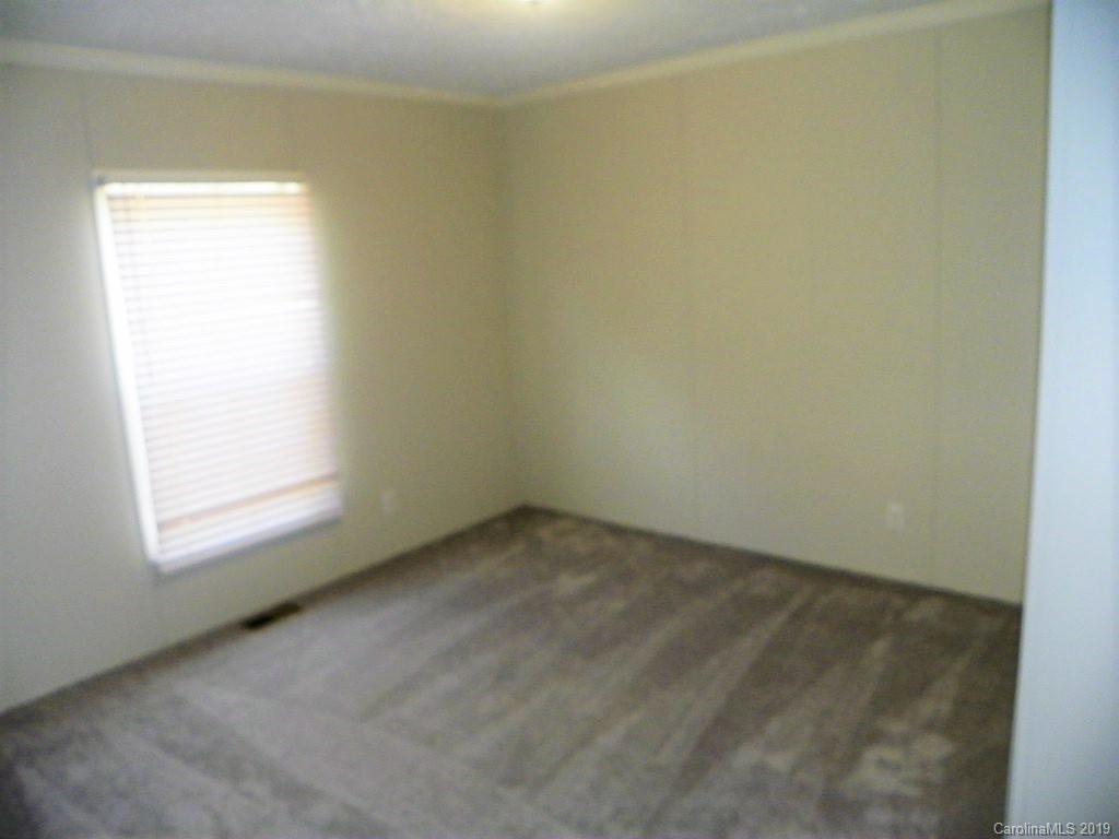2001 Silver Creek Road Mill Spring, NC 28756 - Photo 29 of 31 an empty room with a window