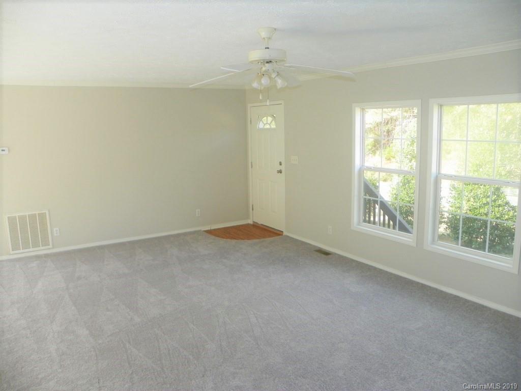 2001 Silver Creek Road Mill Spring, NC 28756 - Photo 10 of 31 an empty room with windows and closet
