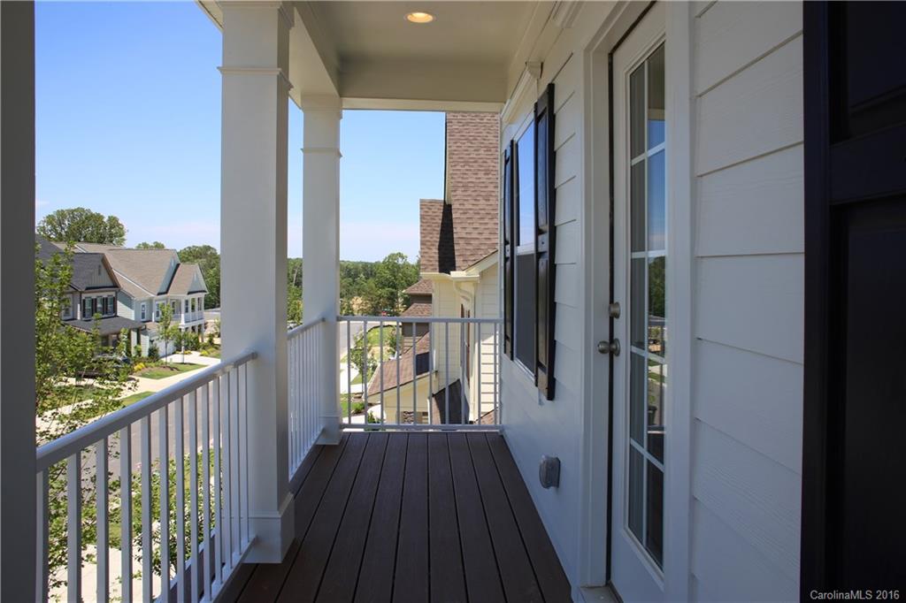 288 Helton Lane, Unit 9 Fort Mill, SC 29708 - Photo 2 of 24 a view of a balcony with wooden floor