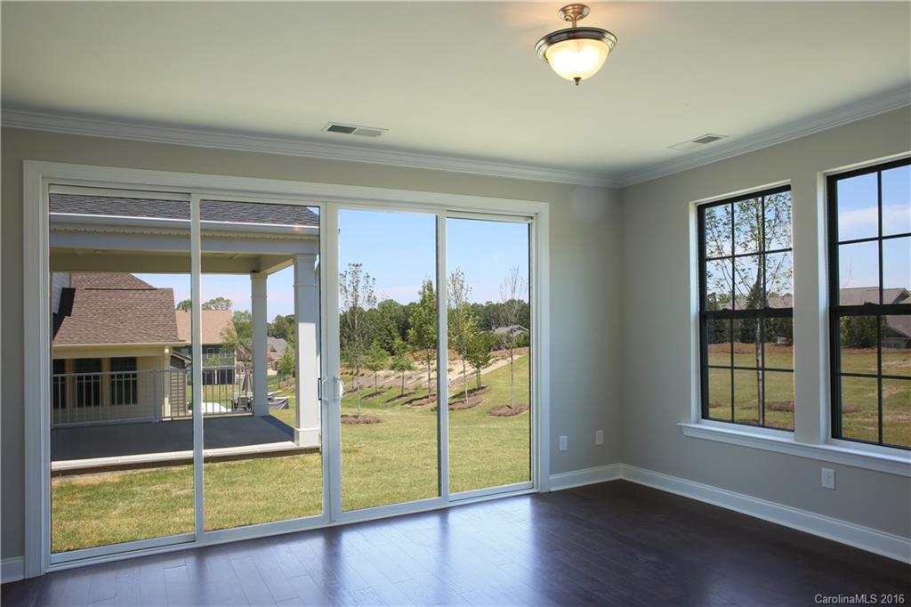 288 Helton Lane, Unit 9 Fort Mill, SC 29708 - Photo 3 of 24 a view of a livingroom with wooden floor and a window
