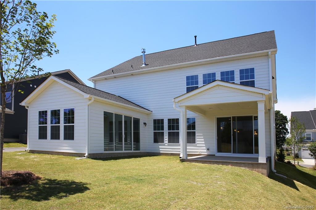 288 Helton Lane, Unit 9 Fort Mill, SC 29708 - Photo 4 of 24 a front view of a house with a yard outdoor seating and garage