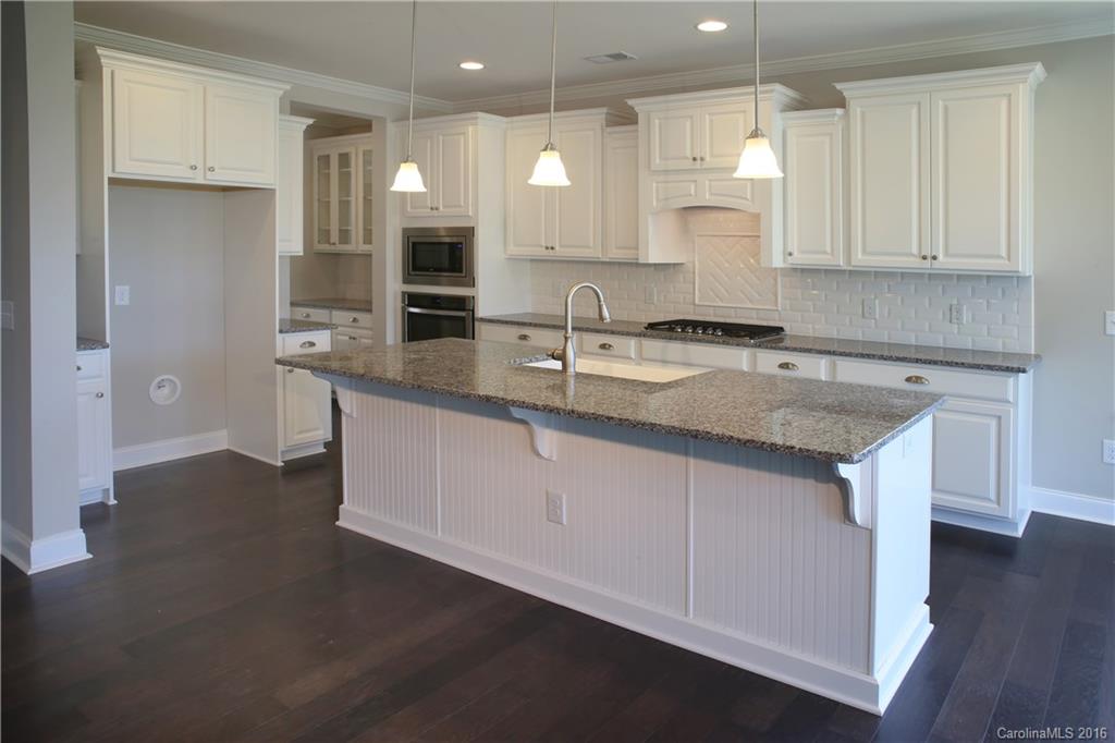 288 Helton Lane, Unit 9 Fort Mill, SC 29708 - Photo 6 of 24 a kitchen with a sink window and cabinets